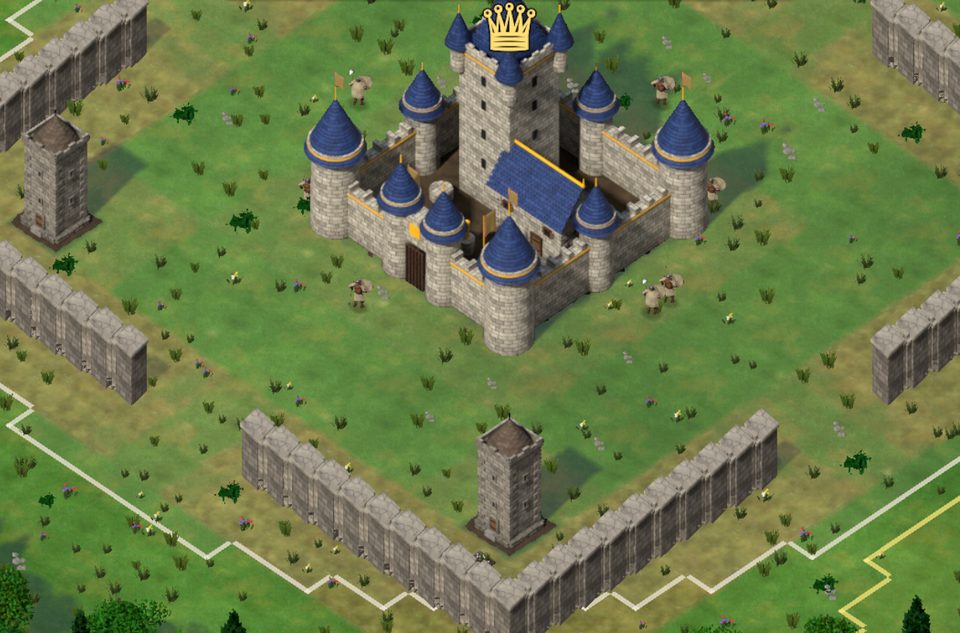 Royal castle with blue towers behind stone walls